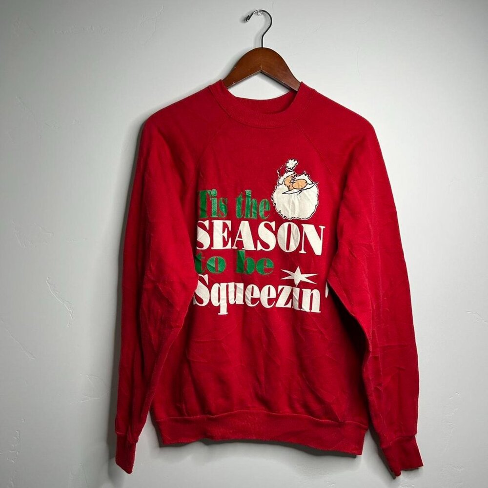 Red vintage Christmas sweatshirt with Santa Claus design
